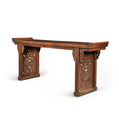 View full screen - View 1 of Lot 234. A 'huanghuali'-veneered recessed-leg table (Qiaotouan), Qing dynasty, 18th / 19th century | 清十八 / 十九世紀 黃花梨單板夾頭榫鳳紋牙頭透雕龍紋擋板翹頭案.