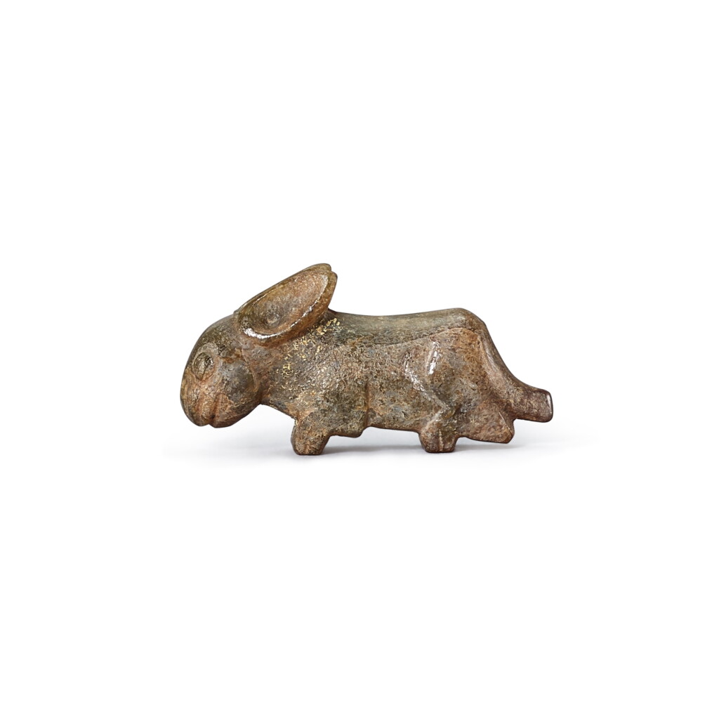 View full screen - View 1 of Lot 455. A greyish celadon jade ‘rabbit’ pendant, Western Zhou dynasty 西周 灰青玉兔珮飾.