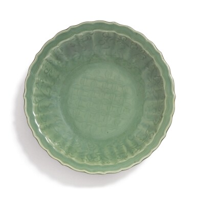 View full screen - View 1 of Lot 508. A 'LONGQUAN' CELADON-GLAZED 'DIAPER AND FLORAL' BARBED-RIM CHARGER, MING DYNASTY.