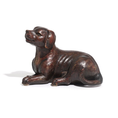 View full screen - View 1 of Lot 19. An English provincial carved and painted wooden model of a dog, late 19th/early 20th century.