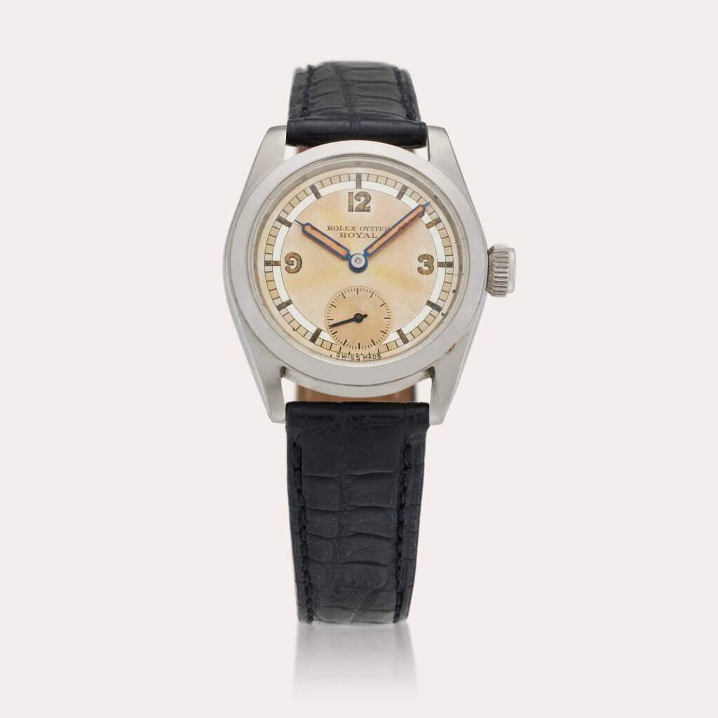 View full screen - View 1 of Lot 416. A stainless steel wristwatch with tropical two-tone sector dial, Circa 1940.