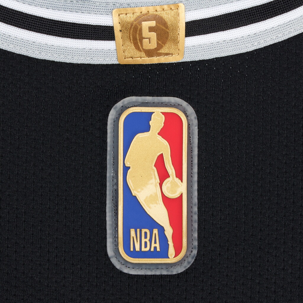 View full screen - View 1 of Lot 8. Stephon Castle San Antonio Spurs 2025-2026 NBA Tip-Off Game Worn Icon Edition Jersey | Special Edition 'Rookie of the Year' Trophy Patch | Gold NBA Logoman.