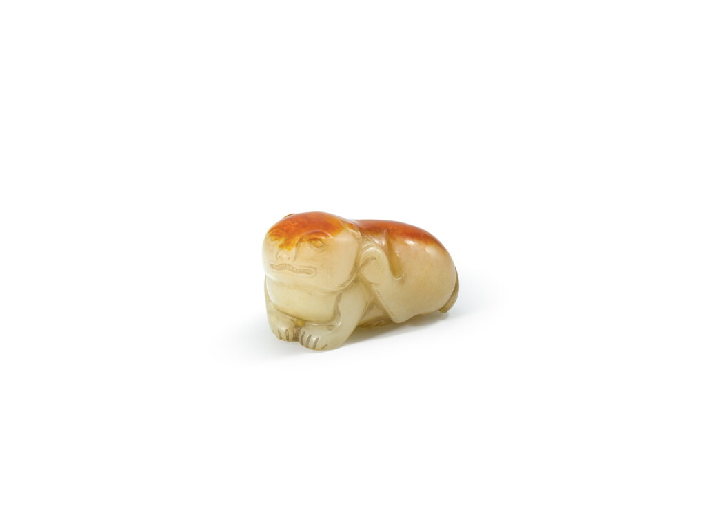 View full screen - View 1 of Lot 2101. A celadon and russet jade figure of a mythical beast Qing dynasty | 清 青玉瑞獸.