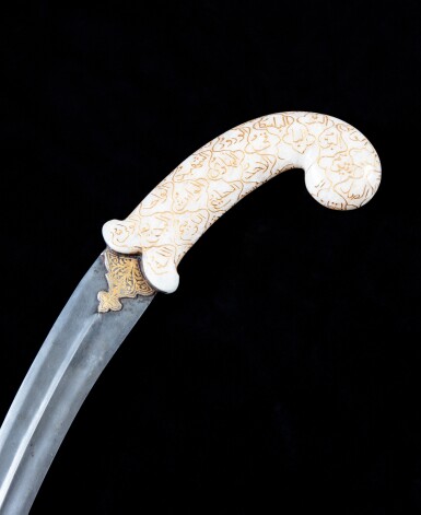 View full screen - View 1 of Lot 194. A jade and an agate hilted khandjar daggers, India, 19th - 20th century | 印度十九至二十世紀 青玉雕羊首形柄及瑪瑙雕柄匕首坎查劍一組兩件.