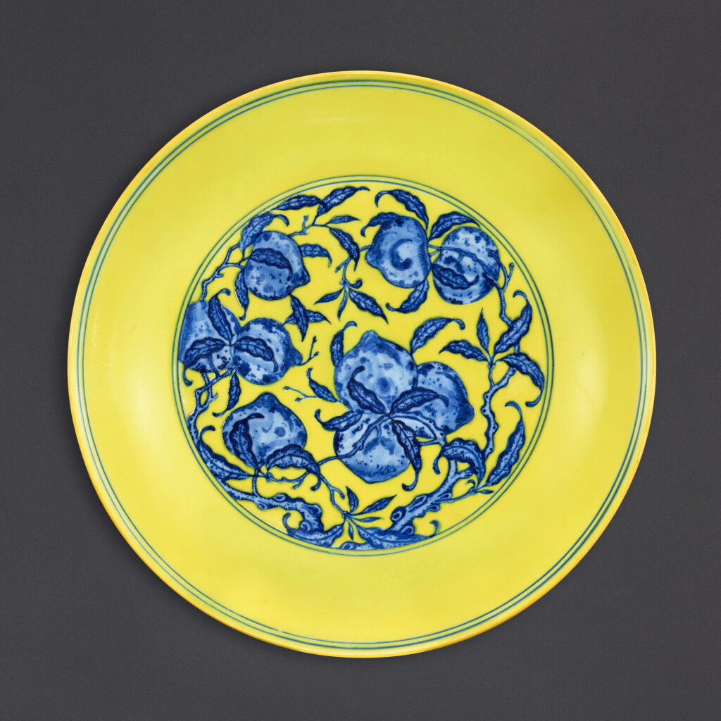 View full screen - View 1 of Lot 3504. A fine yellow-ground blue and white 'peach' dish, Seal mark and period of Qianlong | 清乾隆 黃地青花九桃盤 《大清乾隆年製》款.