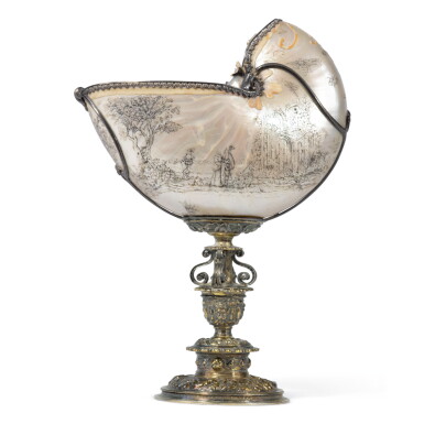View full screen - View 1 of Lot 81. A DUTCH SILVER-MOUNTED NAUTILUS CUP, THE SHELL 2ND HALF OF THE 17TH CENTURY, CIRCLE OF THE BELLEKIN FAMILY OF AMSTERDAM, THE STEM AND FOOT LATE 16TH CENTURY.