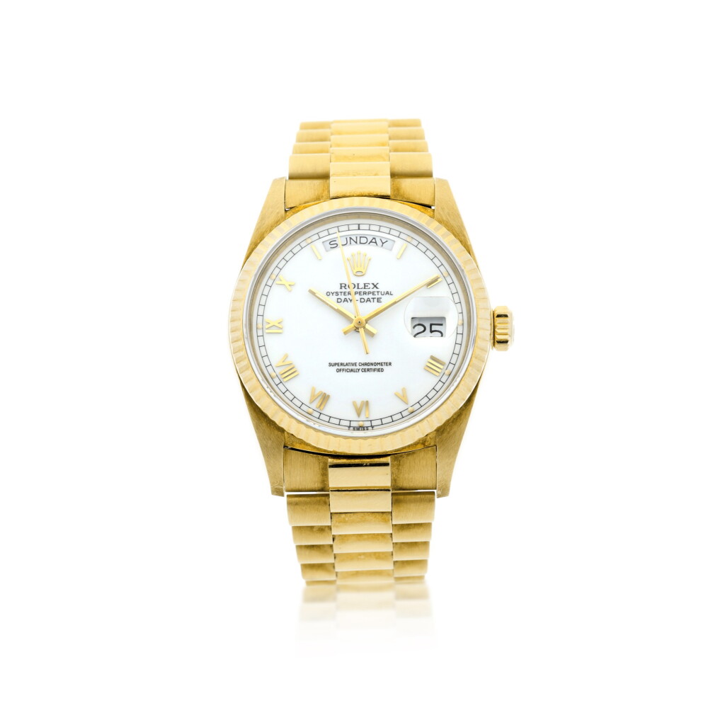 View full screen - View 1 of Lot 120. REFERENCE 18038 DAY-DATE A YELLOW GOLD AUTOMATIC WRISTWATCH WITH DAY, DATE, AND BRACELET, CIRCA 1986.