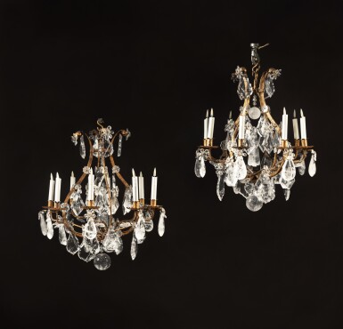 View full screen - View 1 of Lot 582. A pair of Louis XV style gilt-metal and rock crystal cage eight-light chandeliers, 19th century .
