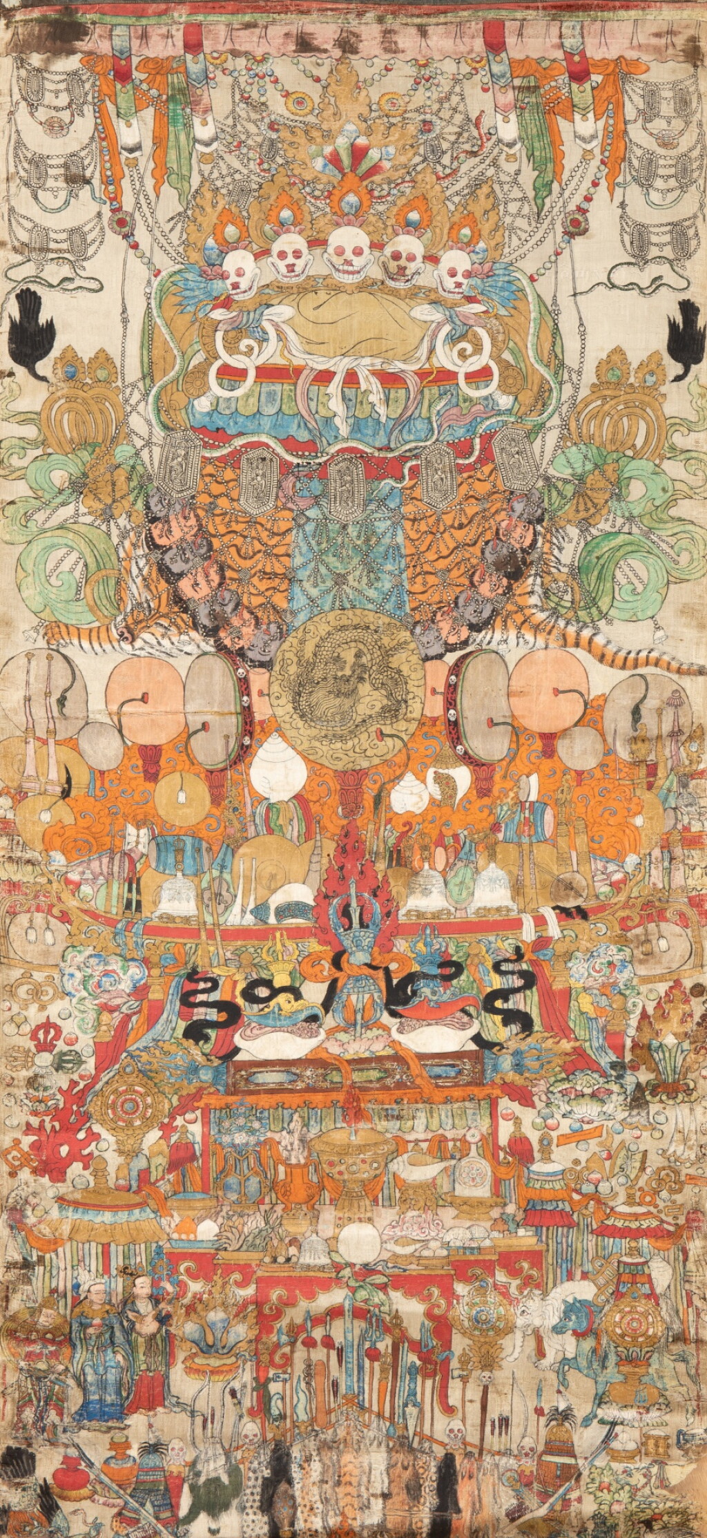 View full screen - View 1 of Lot 14. A rare silk thangka depicting an assembly of emblems, Tibet, circa 18th century | 西藏 約十八世紀 法器唐卡 絹本設色 .