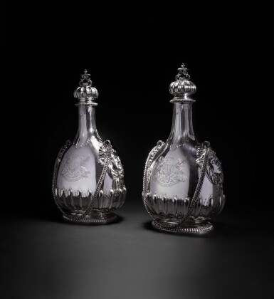View full screen - View 1 of Lot 32. A matched pair of massive Victorian silver pilgrim bottles and covers , one John Bodman Carrington for Carrington & Co., 1892, the other Sebastian Garrard for R. & S. Garrard & Co., 1901, both London.