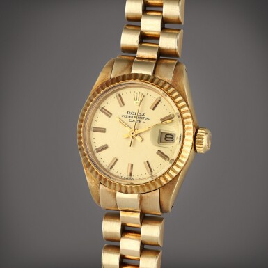 View full screen - View 1 of Lot 81. Reference 6904 Date | A yellow gold automatic wristwatch with bracelet and date, Circa 1977.