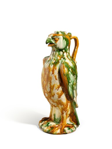 View full screen - View 1 of Lot 1002. An extremely rare sancai-glazed hawk-form ewer, Tang dynasty, 8th century | 唐八世紀 三彩鷹形壺.