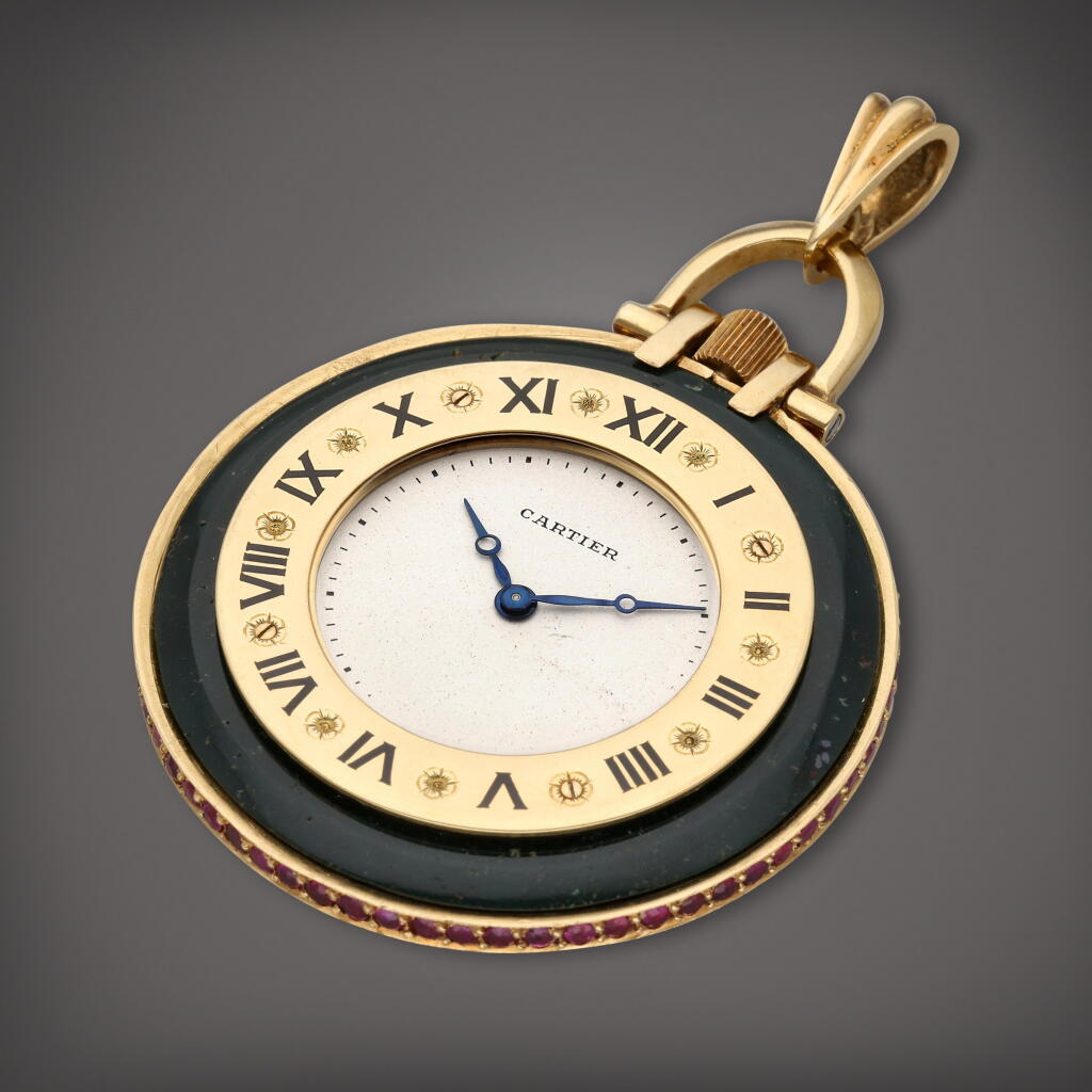 View full screen - View 1 of Lot 411. A yellow gold, bloodstone and ruby set open faced watch, Circa 1930.