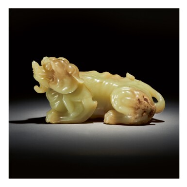 View full screen - View 1 of Lot 227. A LARGE YELLOW AND RUSSET JADE CARVING OF A MYTHICAL BEAST, QING DYNASTY, QIANLONG PERIOD.
