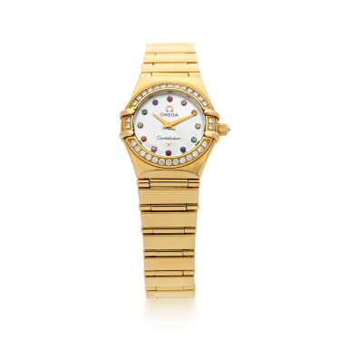 View full screen - View 1 of Lot 1053. CONSTELLATION A YELLOW GOLD AND DIAMOND-SET BRACLET WATCH WITH RAINBOW INDEXES, CIRCA 2005.