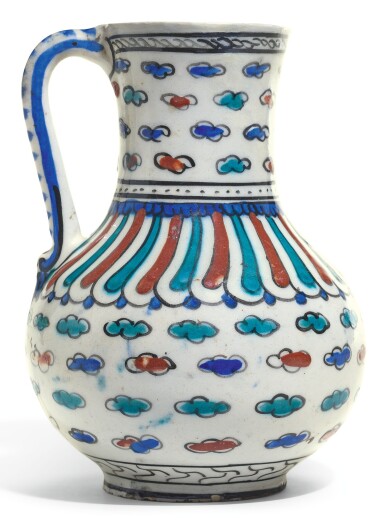 View full screen - View 1 of Lot 489. AN IZNIK POTTERY JUG WITH CLOUDS, TURKEY, CIRCA 1590-1600.