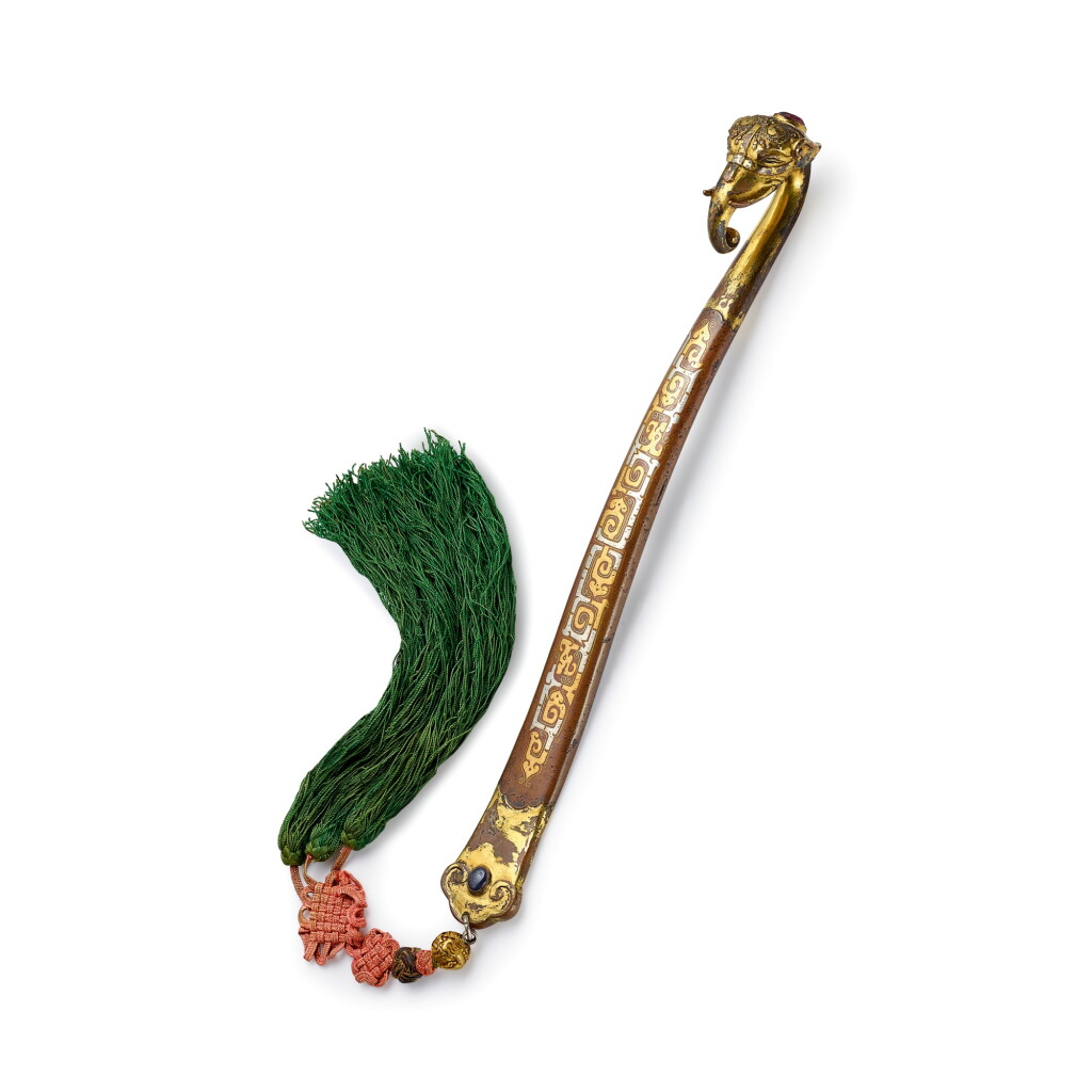 View full screen - View 1 of Lot 281. A rare and outstanding inscribed gold and silver-inlaid copper 'elephant' ruyi sceptre, 17th century | 十七世紀 鎏金銅錯金銀嵌寶象首如意 .