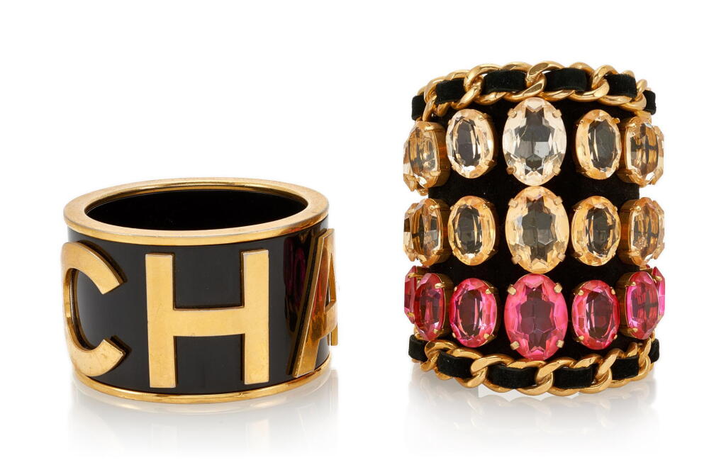 View full screen - View 1 of Lot 40. Black and Gold Enamel and Leather Crystal Embellished Cuffs, Cir 2003 (Bracciali decorati con gemme sintetiche e smalto, 2003).
