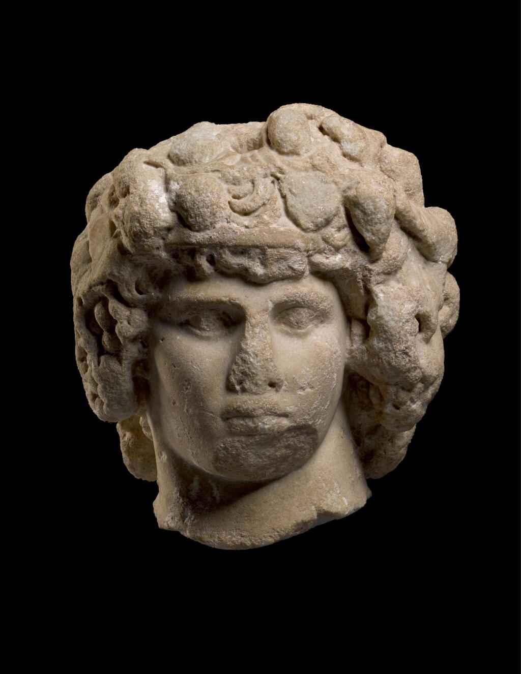 View full screen - View 1 of Lot 251. A MONUMENTAL ROMAN MARBLE PORTRAIT HEAD OF ANTINOUS AS DIONYSOS-OSIRIS, CIRCA A.D. 130–138.