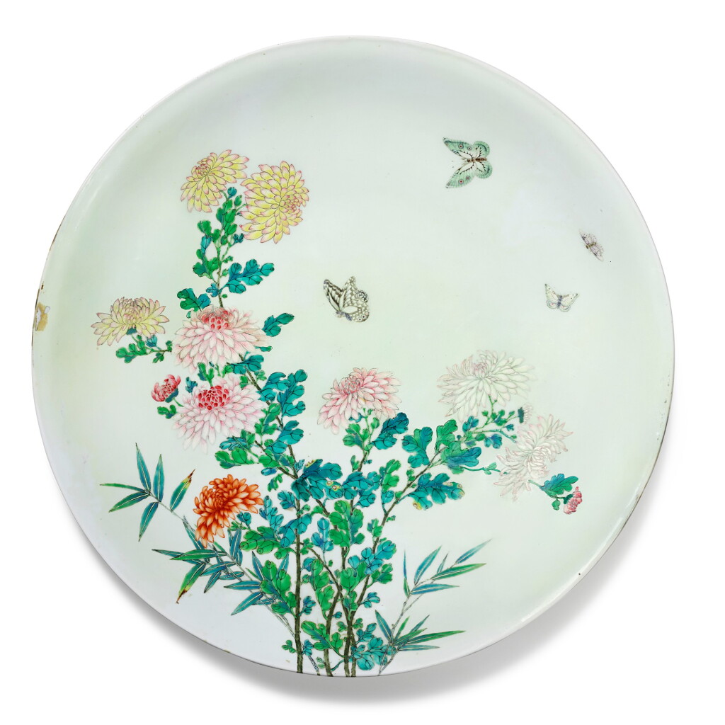View full screen - View 1 of Lot 15. A rare large famille-rose 'chrysanthemum and butterfly' dish, Mark and period of Yongzheng | 清雍正 粉彩過墻蝶戀花紋大盤 《大清雍正年製》款.