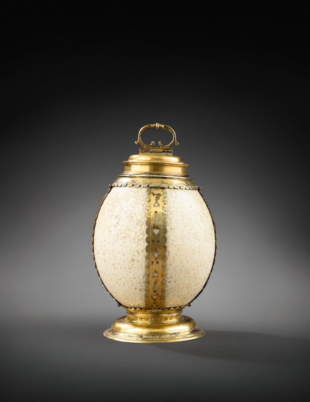 View full screen - View 1 of Lot 133. A German ostrich egg with silver-gilt mounts, probably Germany 17th century and after | Oeuf d'autruche monté en vermeil, probablement Allemagne 17e siècle et après.