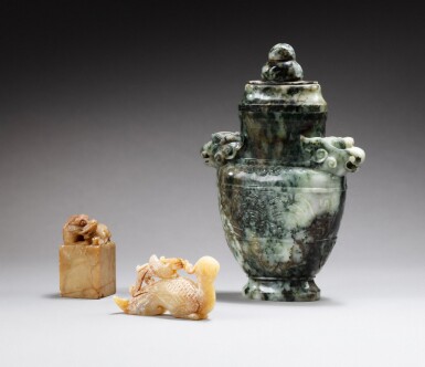 View full screen - View 1 of Lot 204. A green, gray and white jade archaistic vase, a brown steatite seal and a calcified jade phoenix 20th century | 二十世紀 玉石雕一組三件.