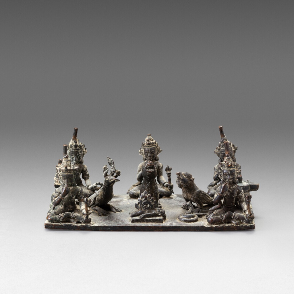 View full screen - View 1 of Lot 122. A copper Bhairava shrine base Nepal, ca. 14th century | 尼泊爾 約十四世紀 銅陪臚龕座.