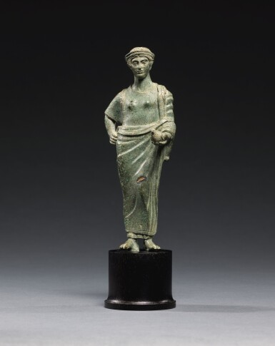 View full screen - View 1 of Lot 11. AN ETRUSCAN BRONZE FIGURE OF A WOMAN, CIRCA 425-400 B.C..