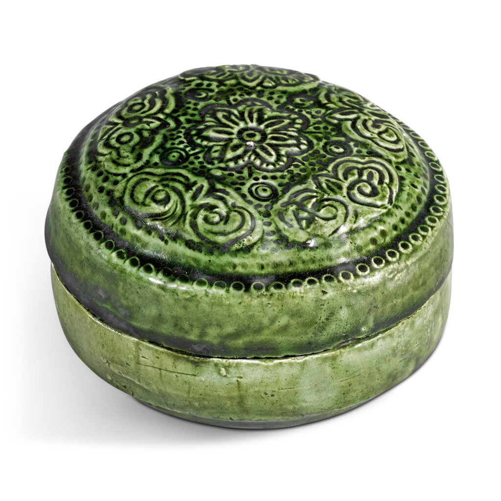 View full screen - View 1 of Lot 8. A rare green-glazed moulded and incised box and cover, Tang dynasty.