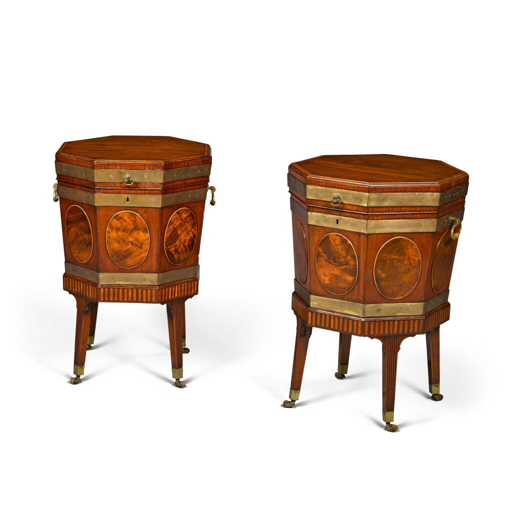 View full screen - View 1 of Lot 61. A pair of George III octagonal brass-bound mahogany wine coolers, circa 1780, in the manner of Mayhew and Ince.