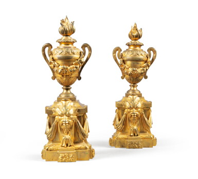 View full screen - View 1 of Lot 40. A pair of gilt-bronze firedogs, late 18th-early 19th century | Paire de chenets au vase en bronze doré de la fin du XVIIIe-début XIXe siècle.