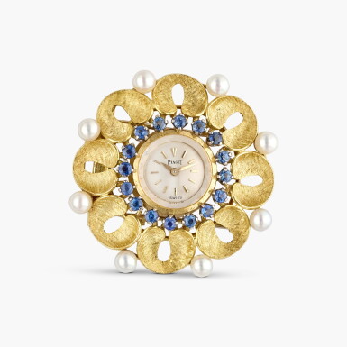View full screen - View 1 of Lot 350. A yellow gold, pearl, and sapphire-set brooch watch, Circa 1960.