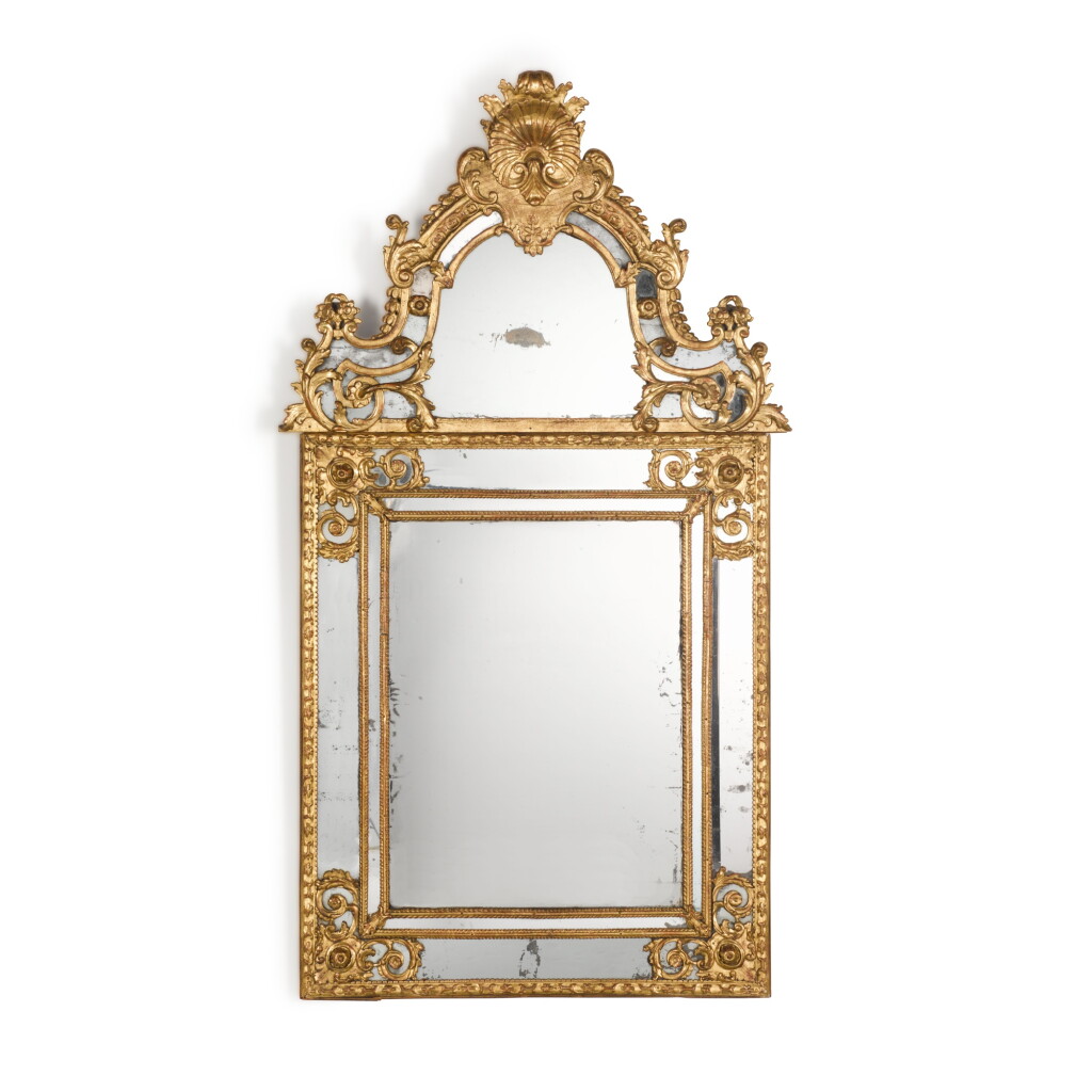 View full screen - View 1 of Lot 53. A Régence carved giltwood mirror, early 18th century.