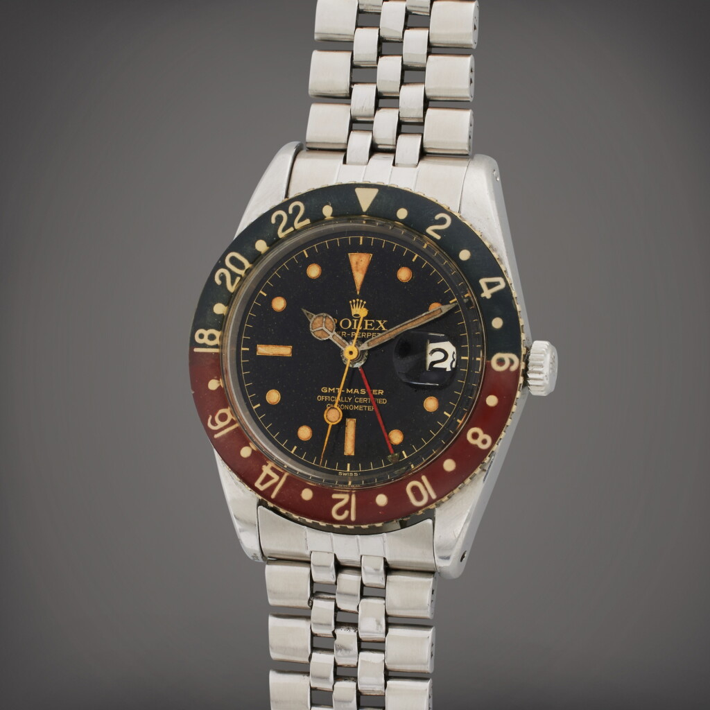 View full screen - View 1 of Lot 148. Reference 6542 GMT-Master | A stainless steel automatic dual time wristwatch with date, bracelet, and bakelite bezel, Circa 1956.
