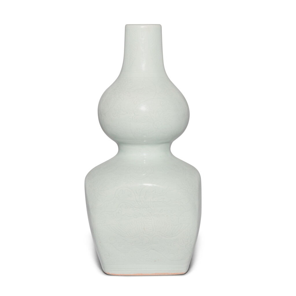 View full screen - View 1 of Lot 688. A rare anhua-decorated white-glazed 'phoenix' double-gourd vase, Mark and period of Jiajing | 明嘉靖 白釉暗刻鳳凰紋葫蘆方瓶 《大明嘉靖年製》款.
