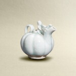 A small qingbai-glazed 'buffalo and boy' melon-shaped dropper, Song dynasty | 宋 青白童子牧牛瓜棱形水注