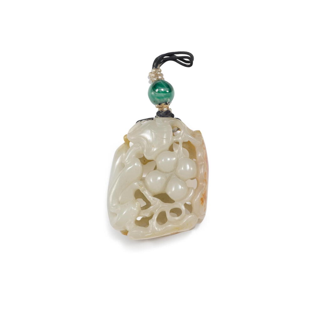 View full screen - View 1 of Lot 800. A white and russet jade openwork 'squirrel and grapes' pendant, Qing dynasty, 18th century | 清十八世紀 白玉鏤雕松鼠葡萄紋珮.