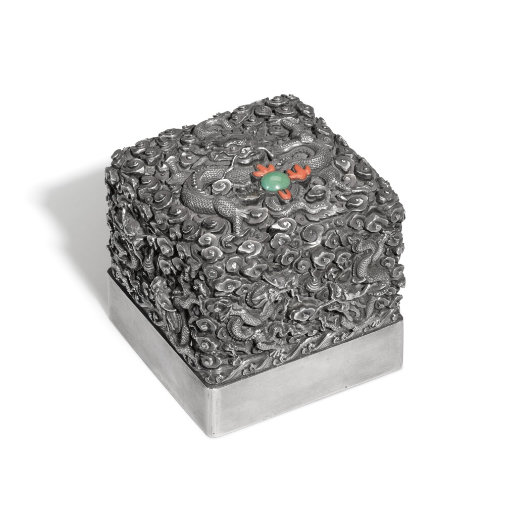 View full screen - View 1 of Lot 426. A turquoise and coral-inlaid silver 'nine dragons' seal | 銀嵌寳九龍戲珠紋璽.