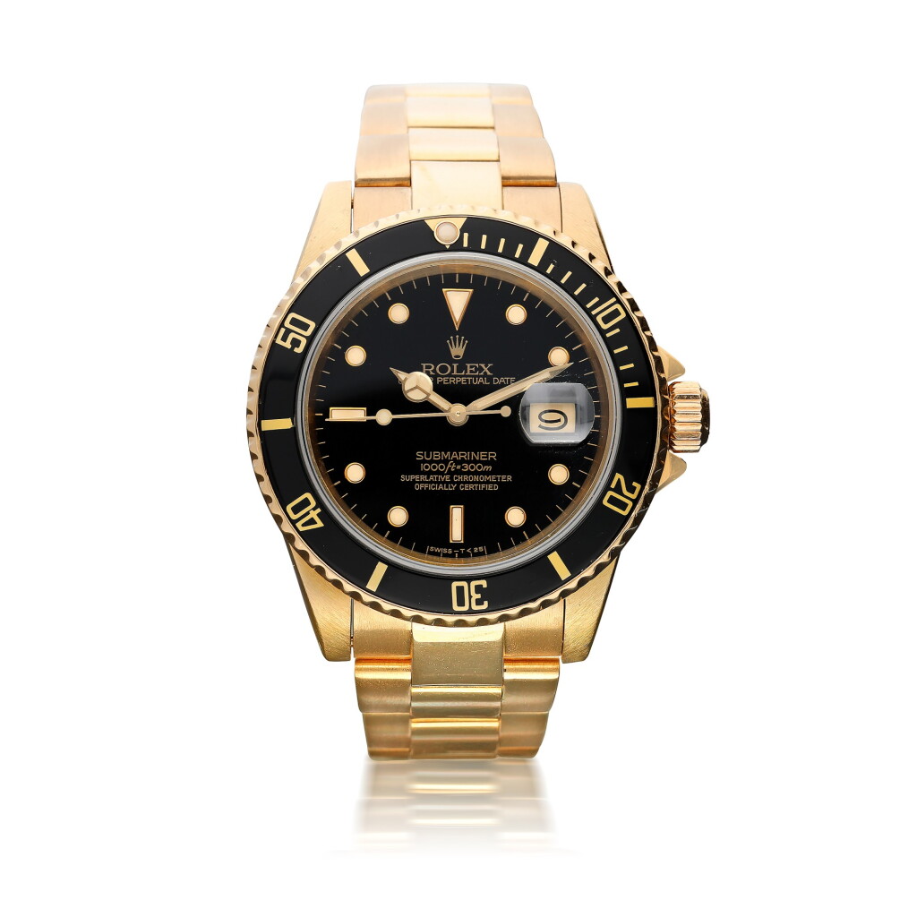 View full screen - View 1 of Lot 42. ROLEX | REFERENCE 16808 SUBMARINER A YELLOW GOLD AUTOMATIC CENTER SECONDS WRISTWATCH WITH DATE AND BRACELET, CIRCA 1984.