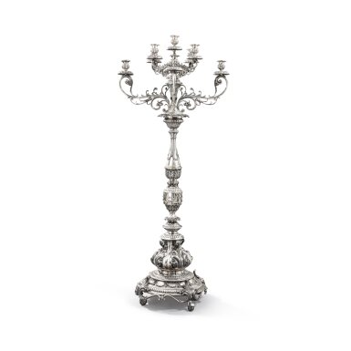 View full screen - View 1 of Lot 132. An Italian large silver nine-light candelabrum in the rococo style, Buccellati, Milan, modern | Grand chandelier en argent à 9 lumières de style Baroque par Buccellati, Milan, moderne.