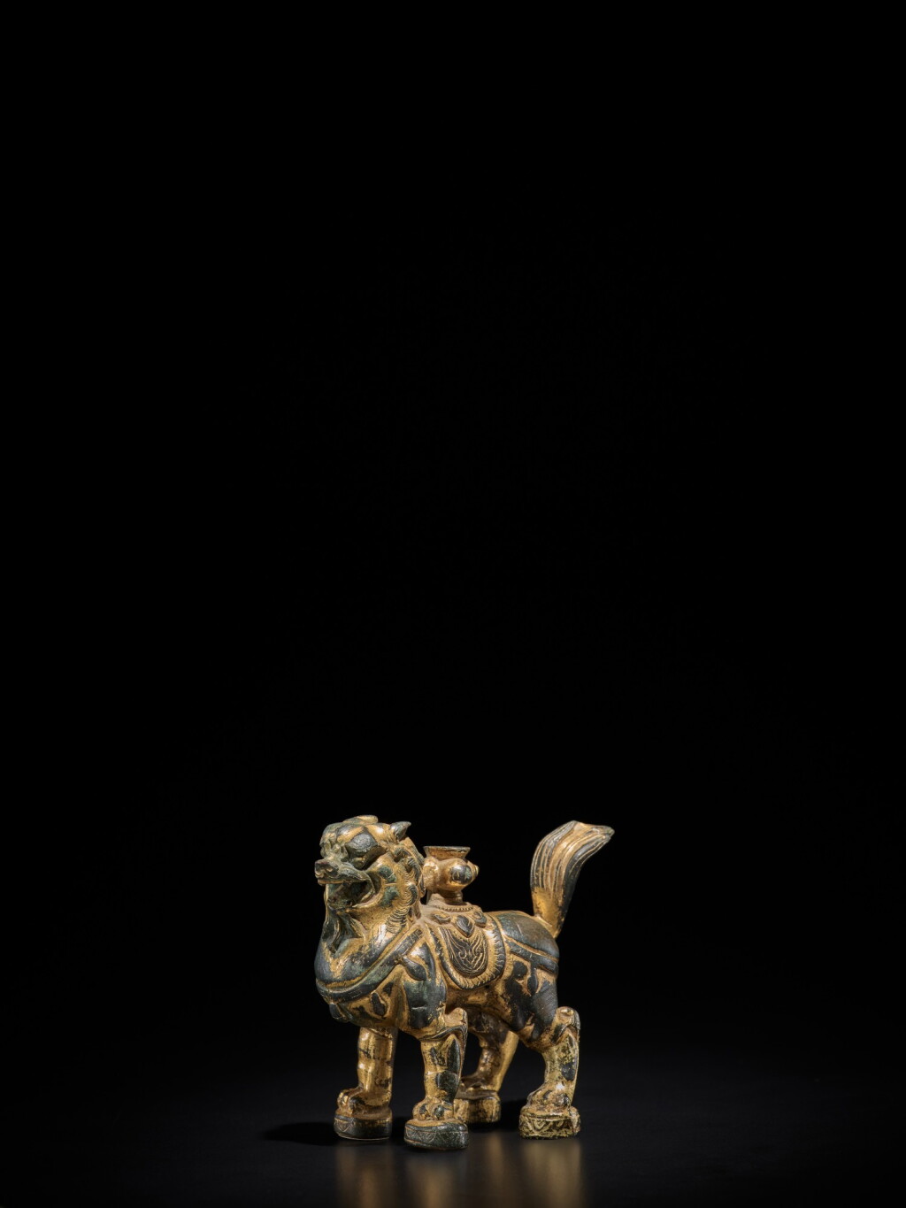 View full screen - View 1 of Lot 106. A gilt-bronze lion-form incense holder, Tang Dynasty | 唐 銅鎏金瑞獅形香插.