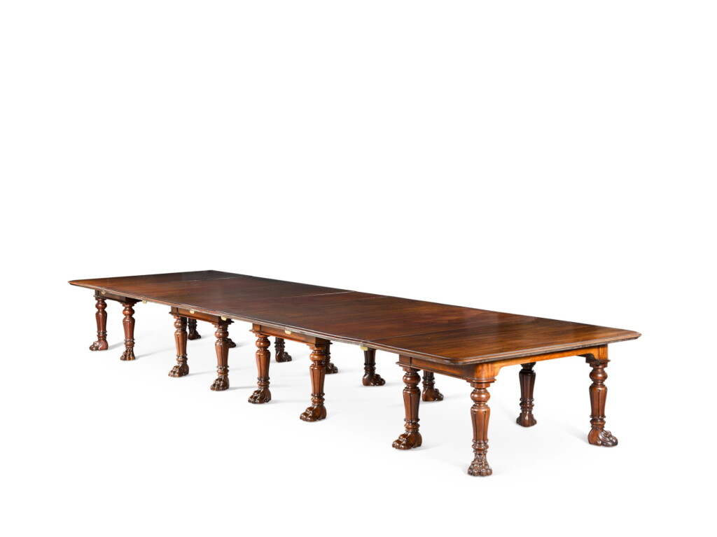 View full screen - View 1 of Lot 60. AN IMPORTANT REGENCY CARVED MAHOGANY EXTENDING DINING TABLE, FIRST QUARTER 19TH CENTURY, IN THE MANNER OF GILLOWS.