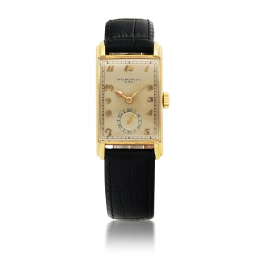 View full screen - View 1 of Lot 402. PATEK PHILIPPE | REF 1559 YELLOW GOLD WRISTWATCH MADE IN 1944.