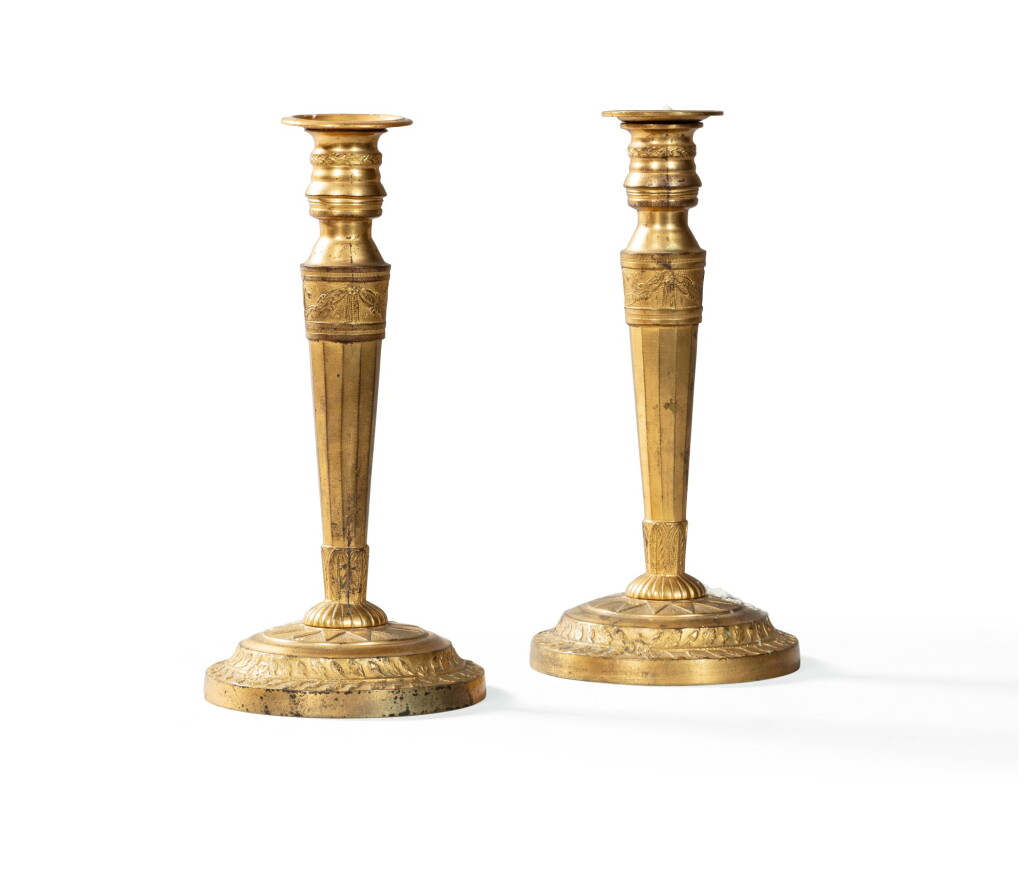 View full screen - View 1 of Lot 64. A pair of gilt-bronze candlesticks, Restauration | Paire de flambeaux commémoratifs en bronze doré, d’époque Restauration.