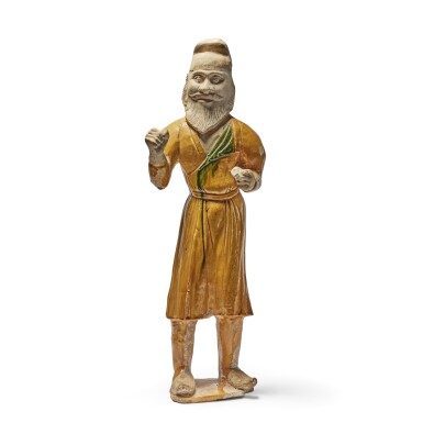 View full screen - View 1 of Lot 247. A large sancai-glazed pottery figure of a foreign groom, Tang dynasty.