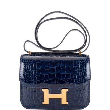 View full screen - View 1 of Lot 3. Hermès Bleu Saphir Constance 18cm of Shiny Alligator with Gold Hardware.