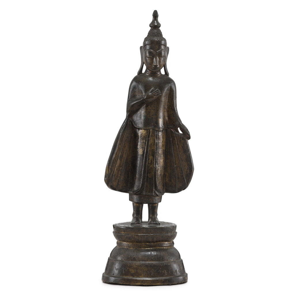 View full screen - View 1 of Lot 3082. An inscribed copper-alloy standing figure of Buddha, Shan State, Burma, 17th - 19th century 十七至十九世紀 緬甸撣邦 銅刻銘文佛像.