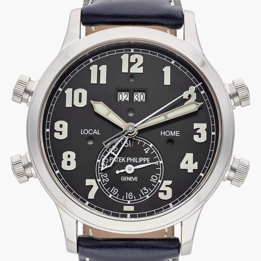 View full screen - View 1 of Lot 187. Reference 5520P-001 Alarm Travel Time | A platinum dual time alarm wristwatch with date, alarm time display, and day/night indication, Circa 2022.