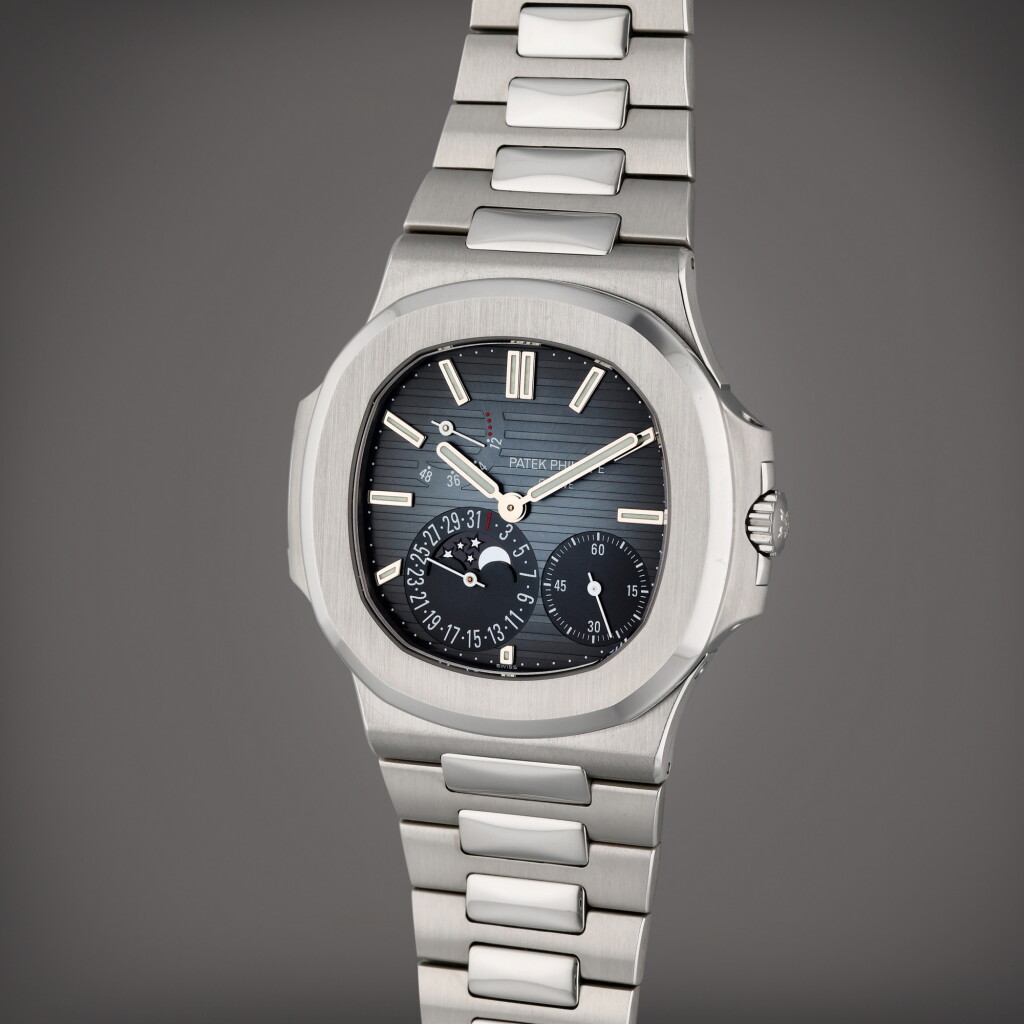 View full screen - View 1 of Lot 331. Reference 5712/1A-001 Nautilus | A stainless steel bracelet watch with date, moon phases and power reserve indication, Circa 2015.