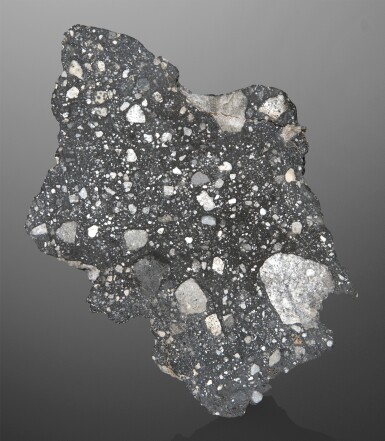 View full screen - View 1 of Lot 120. Lunar Meteorite | End Piece Of The Quintessential Lunar Breccia, Rabt Sbayta 002.